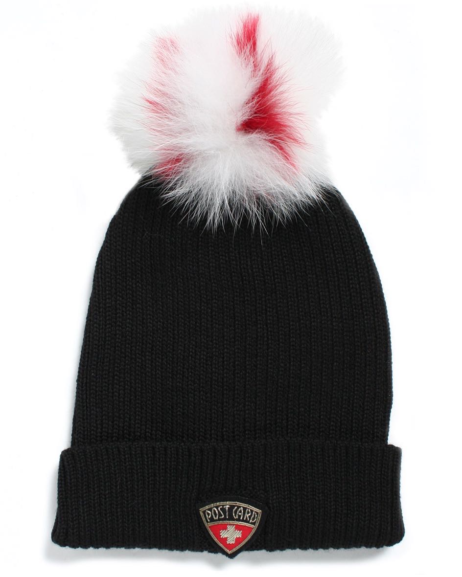 black hat with white pom pom